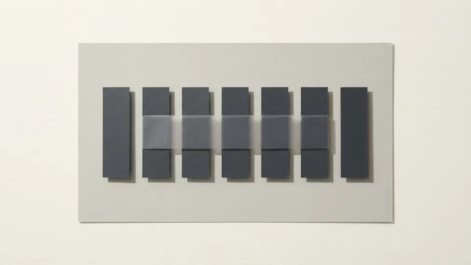 A paper sheet with a row of blank graphite bars, a translucent strip laid across them like a highlight