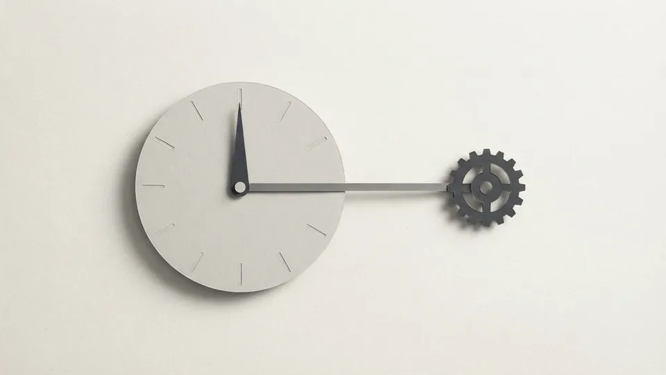 A pale paper clock face without numerals and with a single graphite hand, linked by a paper strip to a small cog